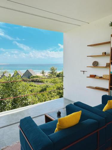 a living room with a view of the ocean at Duna Sonambula in Praia do Tofo