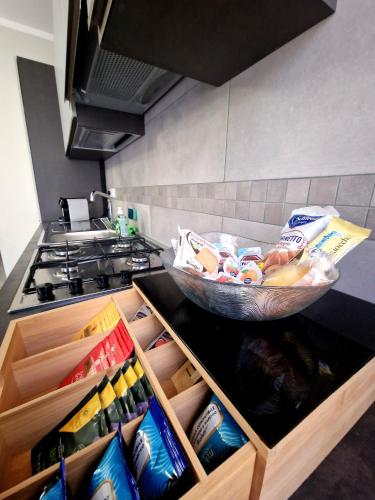 a kitchen with a bowl of food on a counter at Il Filo Rosso in LʼAquila