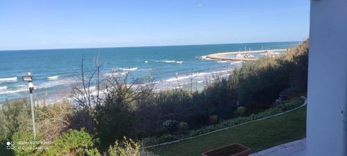 a view of a beach with the ocean at VerdeMare in Rodi Garganico