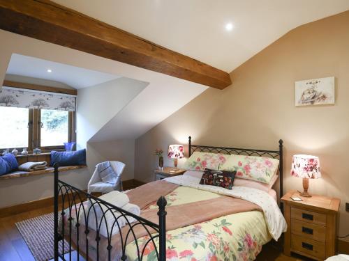 a bedroom with a bed in a room at The Red House - Uk39234 in Shelve