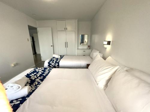 Postel nebo postele na pokoji v ubytování Browns Broadbeach