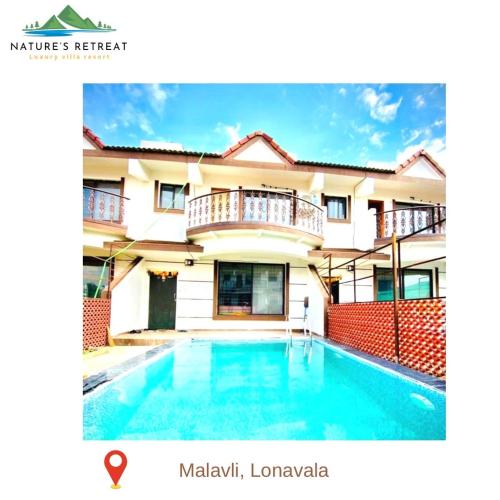 a house with a swimming pool in front of it at Nature's retreat villa malavli in Pune