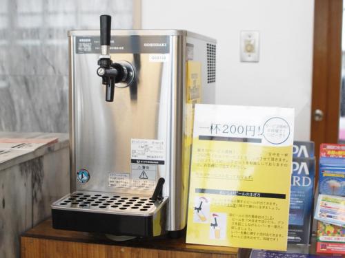 a coffee machine sitting on a table next to a box at APA Hotel Mito-eki Kita in Mito
