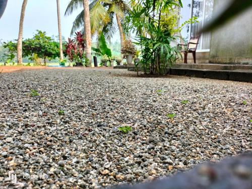 a pile of rocks on the ground in front of a building at Heena Villa in Matara