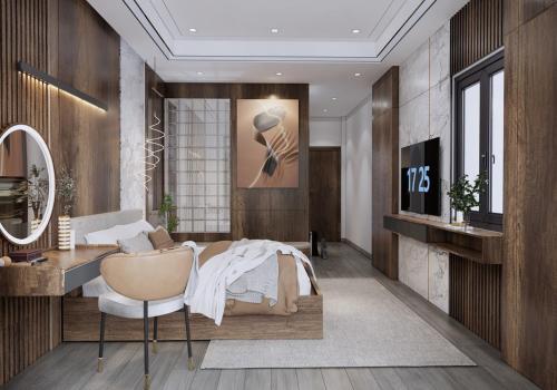 a bedroom with a bed and a desk and a mirror at T&T Luxury Hotel in Quy Nhon
