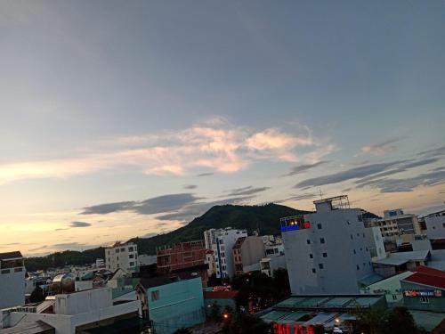 a view of a city with buildings and a mountain at T&T Luxury Hotel in Quy Nhon