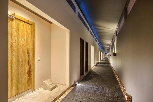 an empty hallway with a door in a building at The Seiryu Boutique Bali Villas in Seminyak