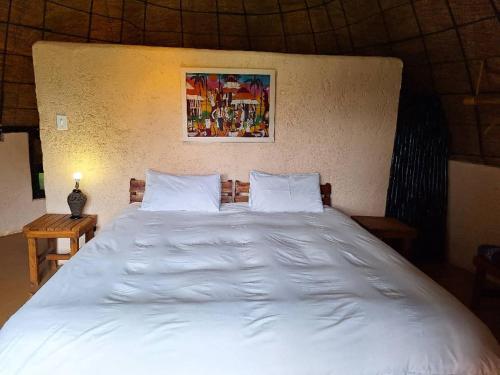 Katil atau katil-katil dalam bilik di Hawane Resort