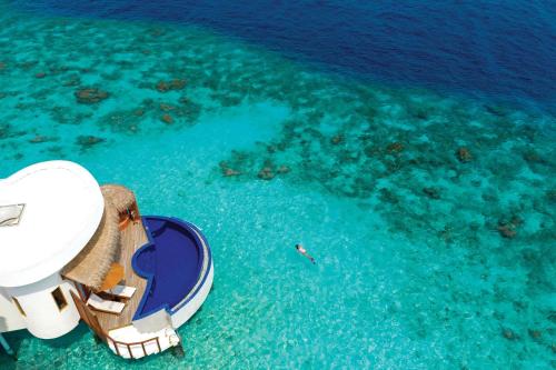 an overhead view of a boat in the water at OBLU SELECT Sangeli - Premium All Inclusive with Free Transfers in North Male Atoll