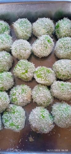 a bunch of donuts with green sprinkles in a pan at BILLABONG SCUBA (B.S.D.S) in Pulau Mabul 