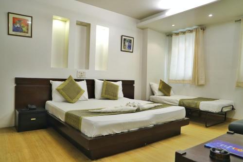 a hotel room with two beds in a room at Hotel Sweet Home Near New Delhi Railway Station in New Delhi