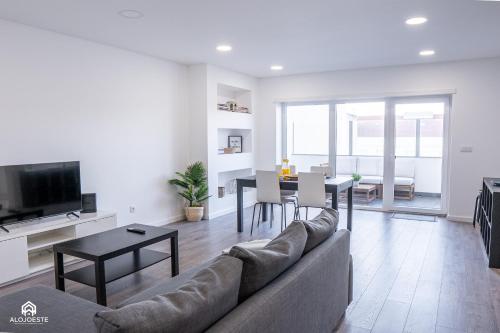 a living room with a couch and a table at Navio Beach Apartment Santa Cruz in Santa Cruz