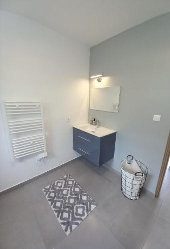 a bathroom with a sink and a mirror at Ti kaz Salazie in Salazie