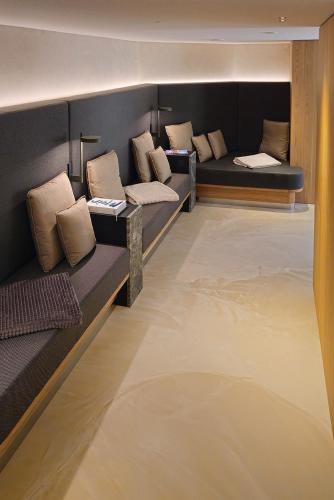a room with couches and pillows on a boat at Hotel Waldblick Kniebis in Kniebis