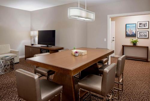 a conference room with a wooden table and chairs at Hilton Garden Inn Downtown Dallas in Dallas