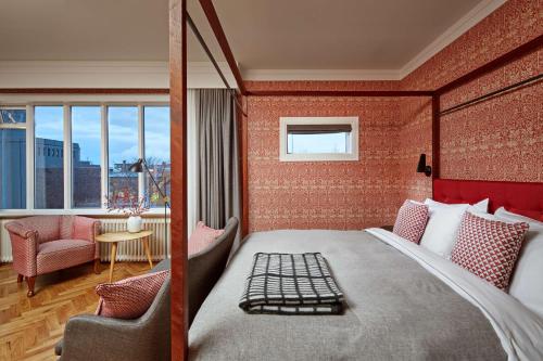 a hotel room with a large bed and a window at Canopy by Hilton Reykjavik City Centre in Reykjavík