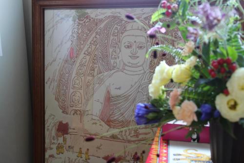a picture of a statue of a goddess with flowers at First Hiroshima in Hiroshima
