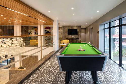 a billiard room with a green pool table at Hyatt Place Goa Candolim in Candolim