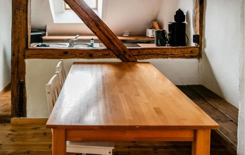 a wooden table in a kitchen with a sink at Ferienwohnung Nicole in Gurvitz