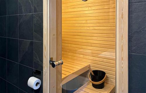 a bathroom with a sauna with a bucket in it at Beautiful Apartment In Idre With House A Panoramic View in Idre