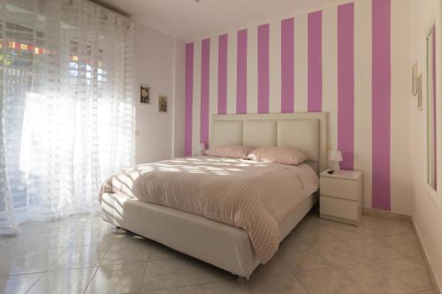 Postel nebo postele na pokoji v ubytování Maison Lillina