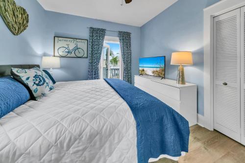 En eller flere senge i et værelse på Four Fish Bungalow 155