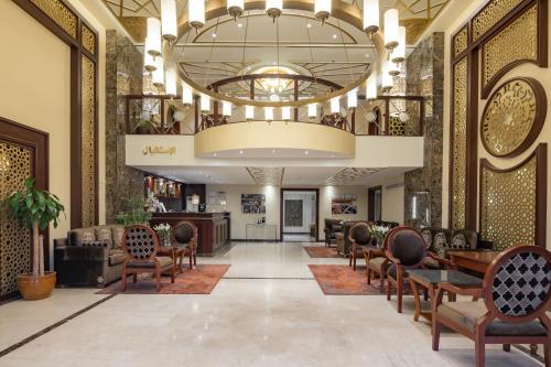 a lobby of a hotel with chairs and tables at Quiet Hotel Al Shatee in Jeddah