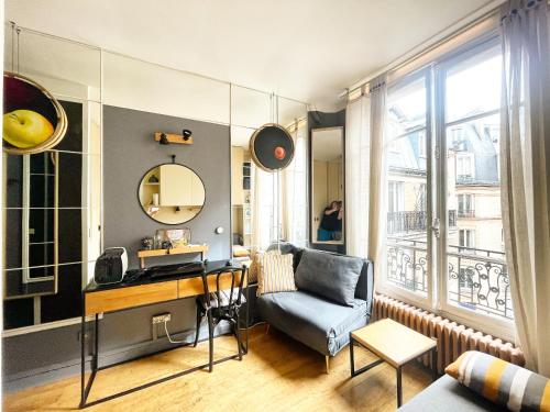 a living room with a desk and a chair at Quartier Latin Paris in Paris