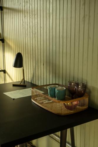 a tray with bowls and cups on a table at La Guarda in Zapallar