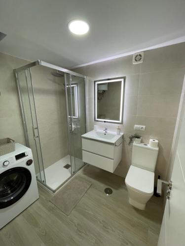 a bathroom with a toilet and a sink and a shower at Benal Beach Estudio Playa in Benalmádena