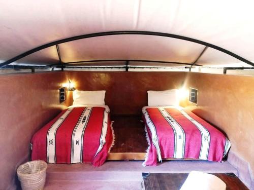 two beds in the back of a boat at Terres d'Amanar in Tahannout