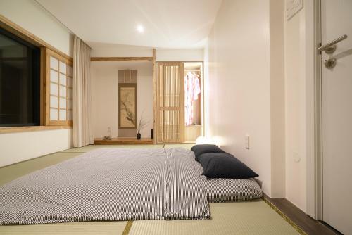 a bedroom with a large bed in a room at Hajime Homestay Hue in Hue
