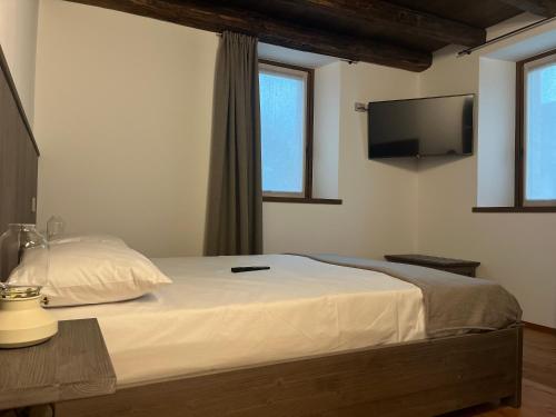 Una cama o camas en una habitación de Ca' di Fiorendo