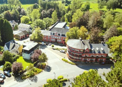 an aerial view of a town with a large building at Hotel de la Gaichel in Eischen