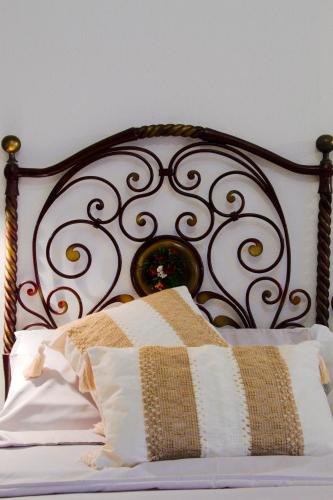 Cama o camas de una habitación en Domuseo