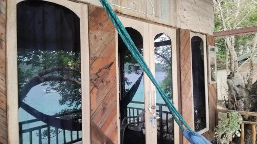 a house being constructed with windows and a hose at Diara bungalow in Iboih