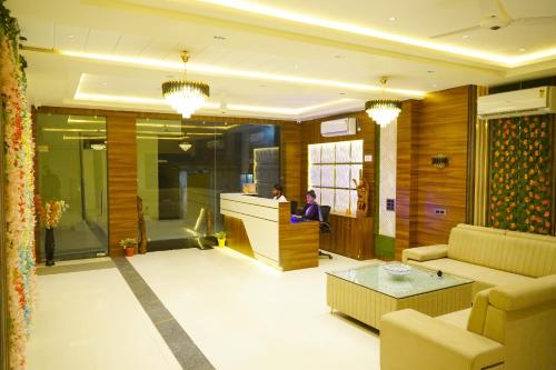 a lobby with a person sitting at a counter at HOTEL SIGNATURE INN in Ambikāpur