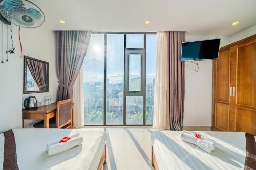 Postel nebo postele na pokoji v ubytování New Sky Hotel