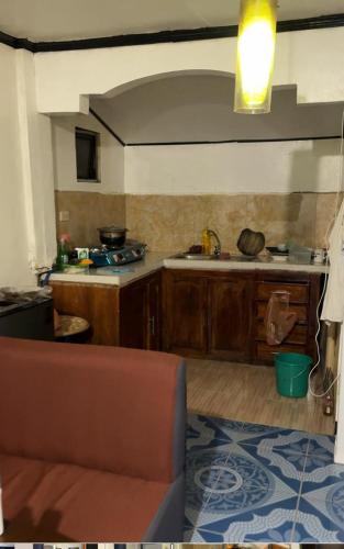 a kitchen with a sink and a counter top at Emmasguesthouse in Paracale