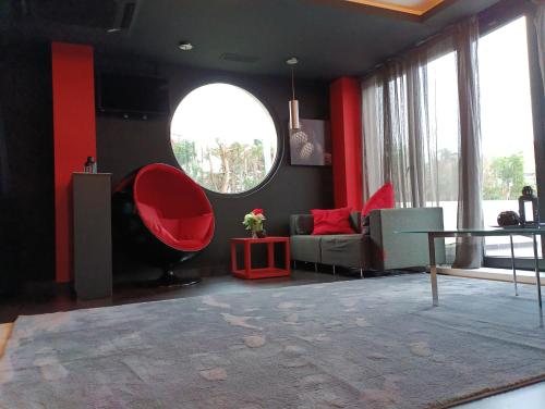 a living room with a couch and a table at Hotel Playa Ribera in Suances