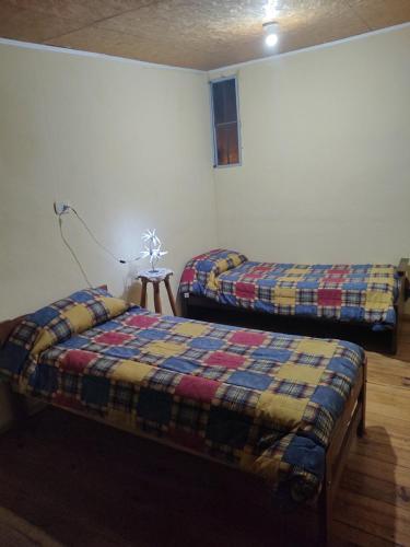 Una cama o camas en una habitación de Dormiduplex