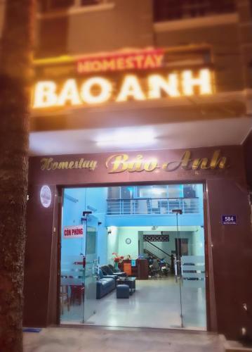 an entrance to a restaurant with a neon sign at Homestay Bảo Anh in Vung Tau