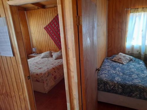 Cama o camas de una habitación en Cabañas EL LUSA