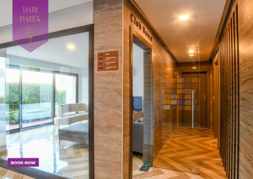 a lobby with a glass door in a building at JourneyJoy II Luxury Apartment with Pool & Gym in Sidi Daoud
