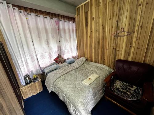 Ένα ή περισσότερα κρεβάτια σε δωμάτιο στο SILENT AM HOMESTAY