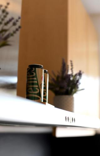 a coffee mug sitting on top of a table at Angela Apartments in Würzburg