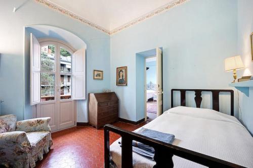 Ένα ή περισσότερα κρεβάτια σε δωμάτιο στο La Vignetta Villa con giardino