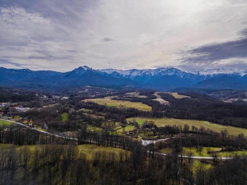 an aerial view of a valley with mountains in the background at Къщата на Mечтите / House of the Dreams in Apriltsi