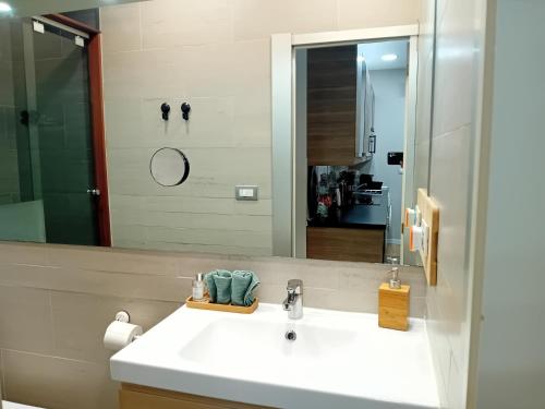 a bathroom with a sink and a mirror at Bonavista Montgat in Montgat