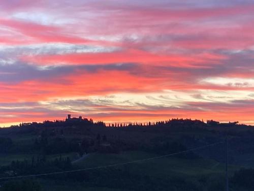 a sunset over a hill with at La casa di Nina in Montespertoli